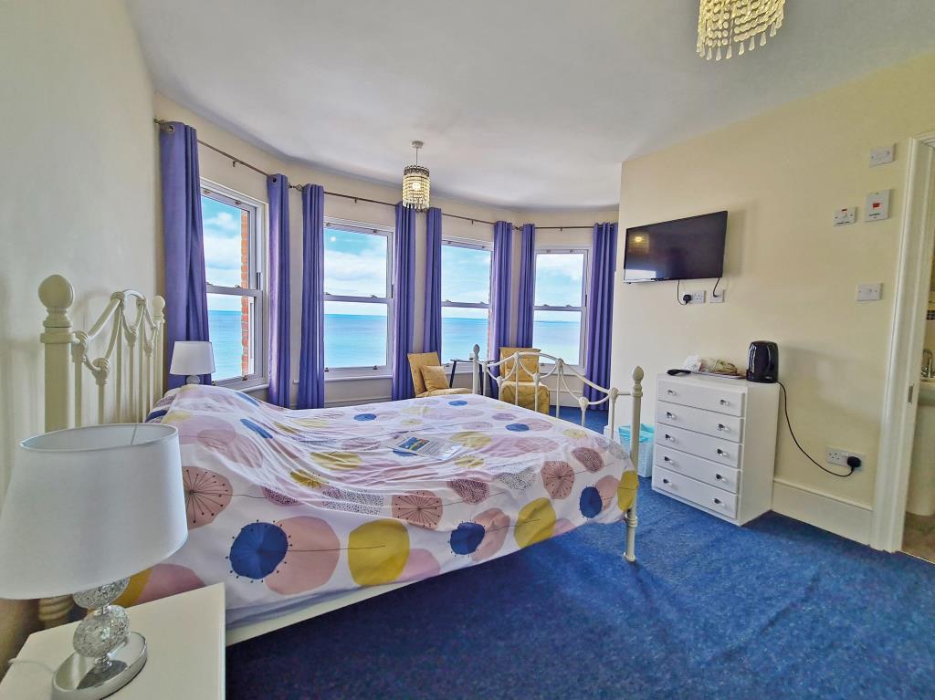 Lot: 148 - SEAFRONT BED AND BREAKFAST WITH POTENTIAL FOR CONVERSION - Bedroom with sea views